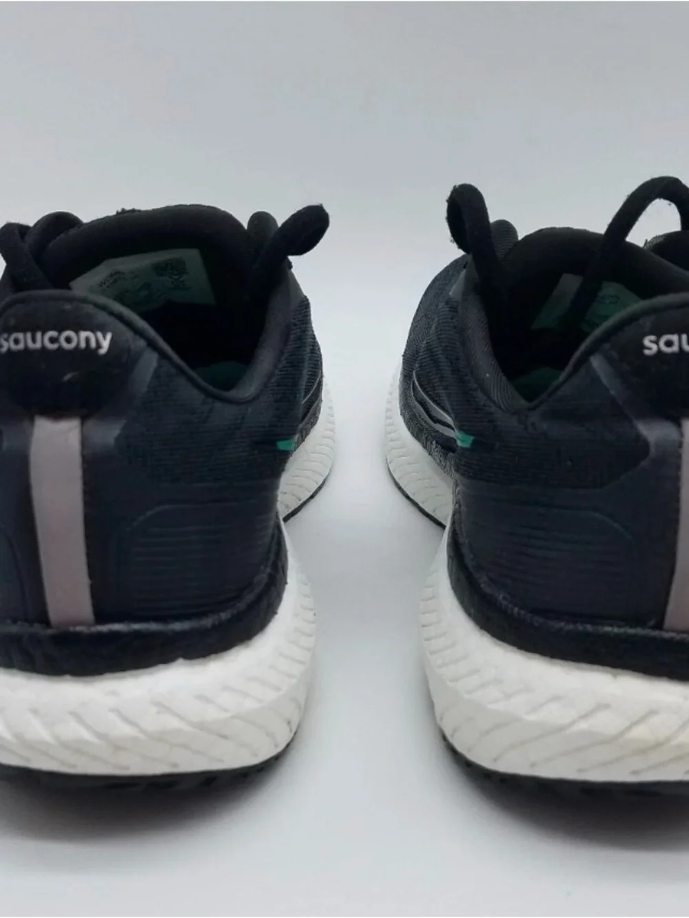 Saucony Black Running Shoes with Teal Accents